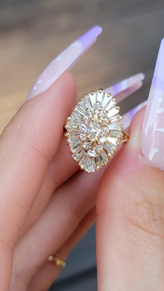 Introducing our exquisite Yellow Gold and Diamond Ballerina Ring. This stunning piece combines timeless elegance with exceptional craftsmanship, making it the perfect accessory to float through any occasion effortlessly. Let its 39 sparkling diamonds and brilliance enhance your style and leave a lasting impression.