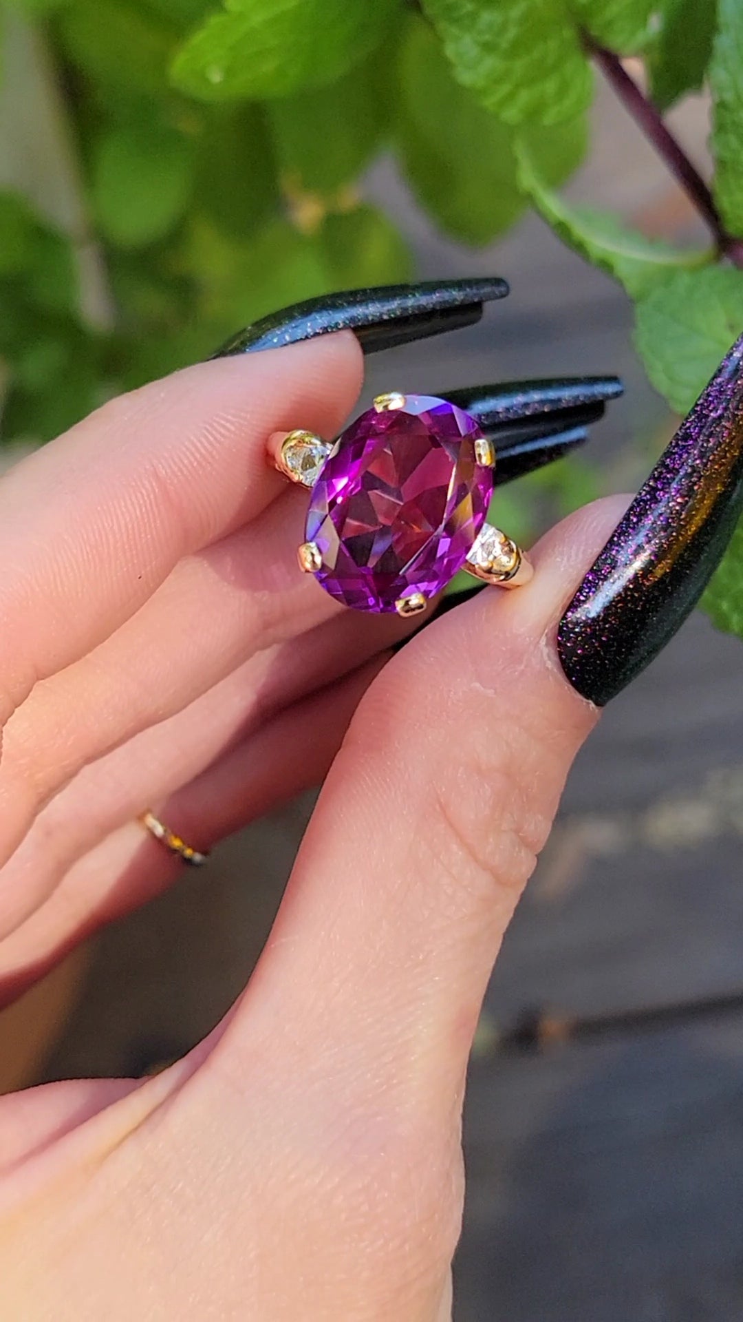I don't know about you, but sometimes I just can't decide what color to choose. This beautiful simulated sapphire understands. You'll see color changes from deep purple to fuchsia. If that wasn't enough color for you, the center stone is flanked by blue topaz side stones. No matter what color mood you're in, this shifty ring has got you covered. Don't miss it!