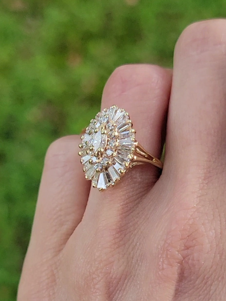 Introducing our exquisite Yellow Gold and Diamond Ballerina Ring. This stunning piece combines timeless elegance with exceptional craftsmanship, making it the perfect accessory to float through any occasion effortlessly. Let its 39 sparkling diamonds and brilliance enhance your style and leave a lasting impression.