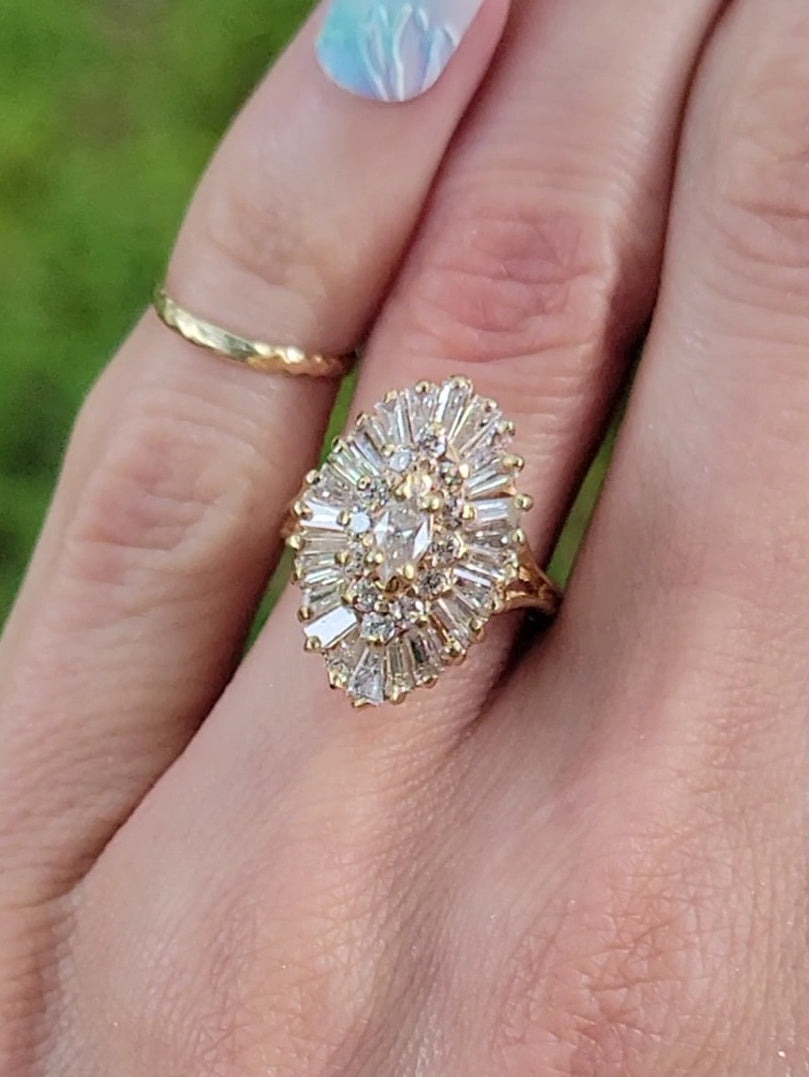 Introducing our exquisite Yellow Gold and Diamond Ballerina Ring. This stunning piece combines timeless elegance with exceptional craftsmanship, making it the perfect accessory to float through any occasion effortlessly. Let its 39 sparkling diamonds and brilliance enhance your style and leave a lasting impression.