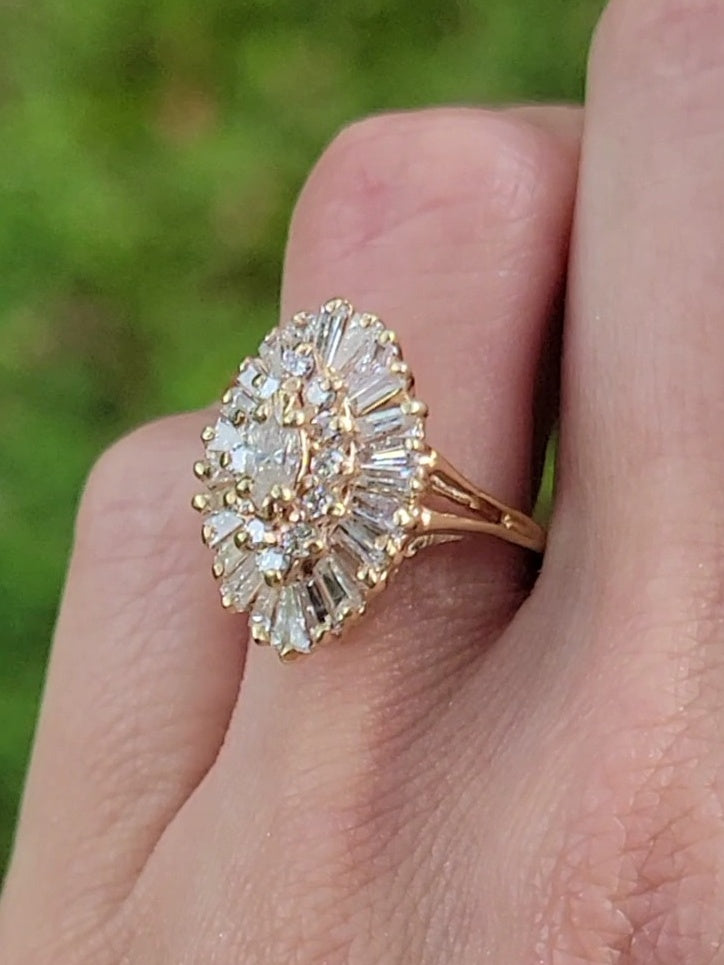 Introducing our exquisite Yellow Gold and Diamond Ballerina Ring. This stunning piece combines timeless elegance with exceptional craftsmanship, making it the perfect accessory to float through any occasion effortlessly. Let its 39 sparkling diamonds and brilliance enhance your style and leave a lasting impression.
