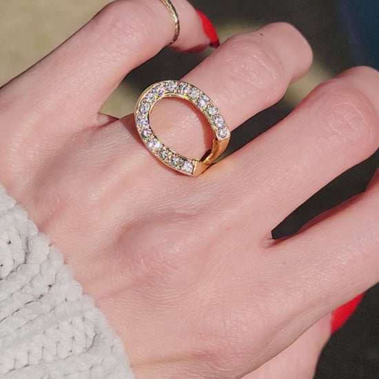 While horseshoes are often a symbol of good luck, this ring is the real deal. She began her life as a world champion and wants you to help you wherever your journey takes you. This unique horseshoe has an amazing East-West orientation that is a fun departure from the standard North-South setting. She features approx. .18ctw of sparkling diamonds. Let luck be your lady tonight. She's from the city that never sleeps so don't be caught sleeping on this one!