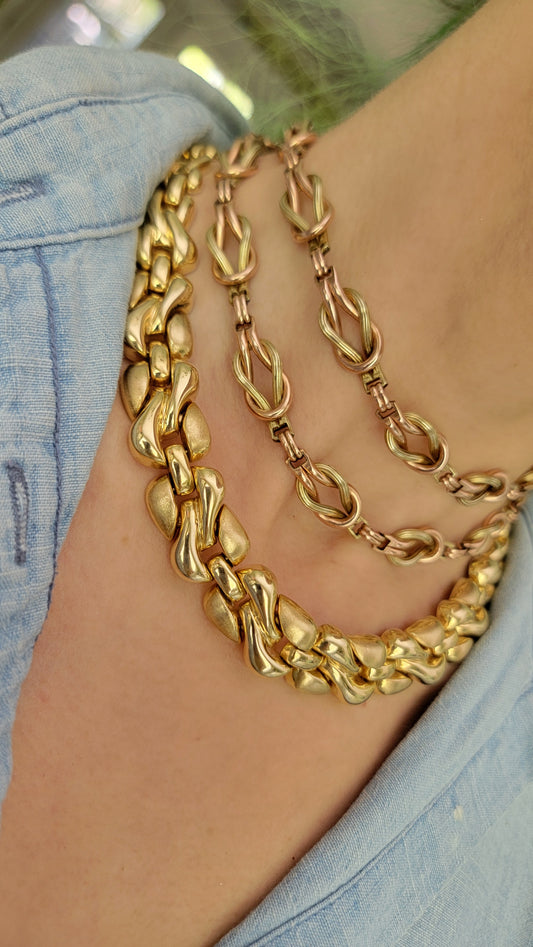 Your beautiful necklace is a 12k gold filled piece. It has green, rose, and yellow gold. The links are both textured/polished finish.  The entire set can be connected or worn as separate pieces. 