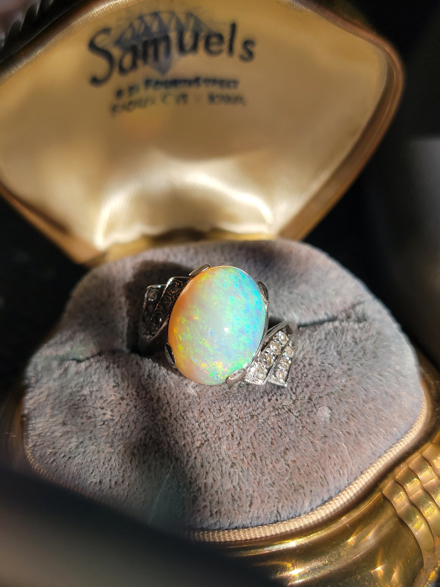 Words really cannot begin to describe this kaleidoscopic Opal. A whopper of an oval cab, set in a 14kt bypass setting with diamonds. Likely custom made in the 1940's. The setting reminds me of a pilot's wings.